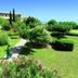 Club Belambra Le Vidourle in Le Grau-du-Roi, landscaped garden path with lush greenery and flowers