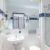Hotel Jean-Paul bathroom with sink, large mirror, and glass shower in Schwarzenbach an der Saale