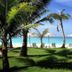 Mali Resort Pattaya Beach Koh lipe beachfront lawn with palm trees, loungers and turquoise sea in Ko Lipe