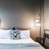 Hotel Leifur Eiriksson in Reykjavik room with bed, butterfly wall art, and bedside lamps