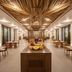 Secrets Tulum Resort And Beach Club restaurant with woven wood ceiling and dining tables in Tulum