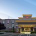 Hampton Inn Turlock hotel exterior with covered entrance and landscaped front drive