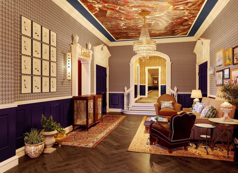 Graduate by Hilton Evanston lobby with crystal chandeliers, ornate ceiling mural and seating area
