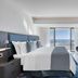 Parklane, a Luxury Collection Resort & Spa, Limassol: modern bedroom with sea-view balcony and TV