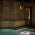 Hotel Belvedere in Kingston features an indoor stone-walled pool with built-in seating