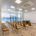 Marina Burgas Hotel in Burgas conference room with rows of chairs and sea view through glass doors