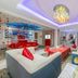 Real Madrid Holiday Island Style Hotel (Haikou Qilou Old Street) room with red-themed decor and seating