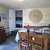Il Borgo di Campi in Riomaggiore: rustic room with dining table, wall-mounted TV, and open doorway to bed