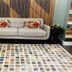 Lobby seating area at Blaine Town Inn & Suites in Blaine with sofa, patterned rug and side tables