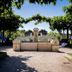 Auberge La Fontaine Aux Bretons in Pornic, garden courtyard with stone fountain and trees