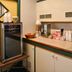 Breakfast nook at Red Carpet Inn North East with coffee maker, mini fridge and snack display