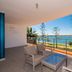 Silvershore Apartments on the Broadwater balcony with wicker seating and ocean views in Biggera Waters