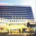 Rachaphruk Grand Hotel in Nakhon Ratchasima with a lit exterior and fountain at dusk