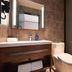 Hanting Hotel Lujiazui South Pudong Road bathroom with vanity, mirror, toilet and glass shower in Shanghai