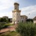 La Vecchia Torre in San Nicola Manfredi with a historic tower, garden path, and countryside view