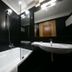 Mediterranea Hotel & Convention Center, Salerno: modern black-tiled bathroom with bathtub, sink and shower.
