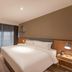 Home Inn Suzhou Mudu Ancient Town Lingyanshan Metro Station guest room with king bed, desk and large window