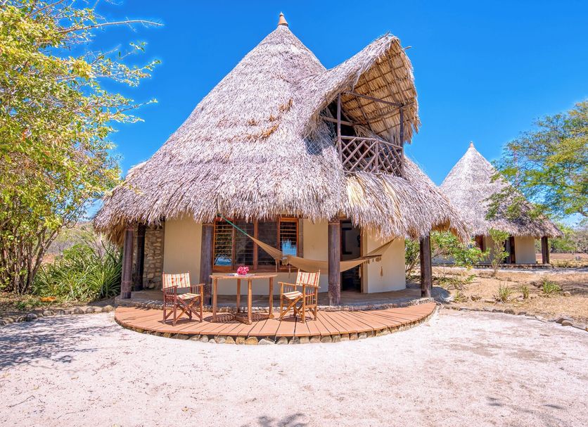 Hotel Punta Teonoste Boutique Beachfront Resort in Rivas, thatched beachfront bungalow exterior