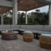 Home2 Suites by Hilton Lake City patio with fire pit, sectional seating and woven stools