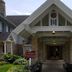 Maxwelton Braes Lodge entrance in Baileys Harbor with stone portico and landscaped grounds