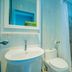 The Rubber Hotel (Sha Plus+) bathroom with sink, toilet and walk-in shower in Thep Krasattri