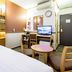 Toyoko Inn Himeji eki Shinkansen Minami guchi guest room with bed, desk, TV and small table in Himeji
