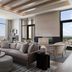 Loews Arlington Hotel lounge with city views, sectional sofa, dining table, and fireplace in Arlington.