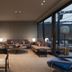 WorldHotel Casati 18 Milan lounge with seating area and floor-to-ceiling glass doors