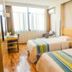 Greentree Inn Ningguo Ningguo Avenue room with two twin beds, window seating and wood flooring in Xuancheng