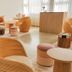 Shepherd's Run in South Kingstown lounge with sculptural wood chairs, stools and soft window light