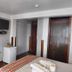 El Mirador de Santa Ana, Cusco: guest room with bed, wardrobe, TV, and wooden doors