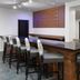 Wingate by Wyndham Sheboygan bar seating area with high-top counter and stools