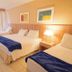 Eldorado Atibaia Eco Resort guest room with three beds and bright window seating in Atibaia