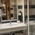 Parador De La Seu D'urgell bathroom with sink, mirror and glass shower in La Seu d'Urgell
