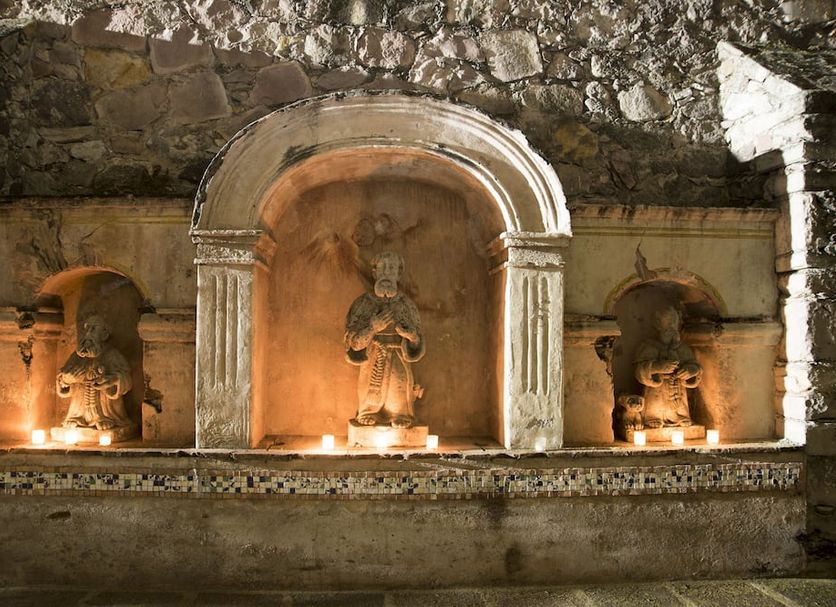 Hotel Ex-Hacienda San Xavier in Guanajuato, ornate stone niche with illuminated statues and arched alcove
