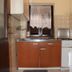 Apartments Alissa in Hvar kitchen with stove, sink, mini fridge and patterned tile backsplash
