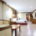 Ao Nang Beach Resort in Krabi guest room with twin beds, sofa seating and desk