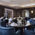 Hotel Gladbeck van der Valk dining room in Gladbeck with round tables and blue velvet chairs