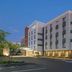 Fairfield Inn & Suites by Marriott Tampa Westshore/Airport exterior in Tampa with palm trees and parking lot
