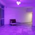 Hotel Sea Coast in Digha: purple-lit indoor lounge with seating and marble flooring
