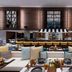 W Algarve in Albufeira lounge with bar, plush seating and geometric windows