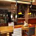 Anemon Ege Hotel in Izmir restaurant interior with wooden tables, plaid chairs and warm lighting