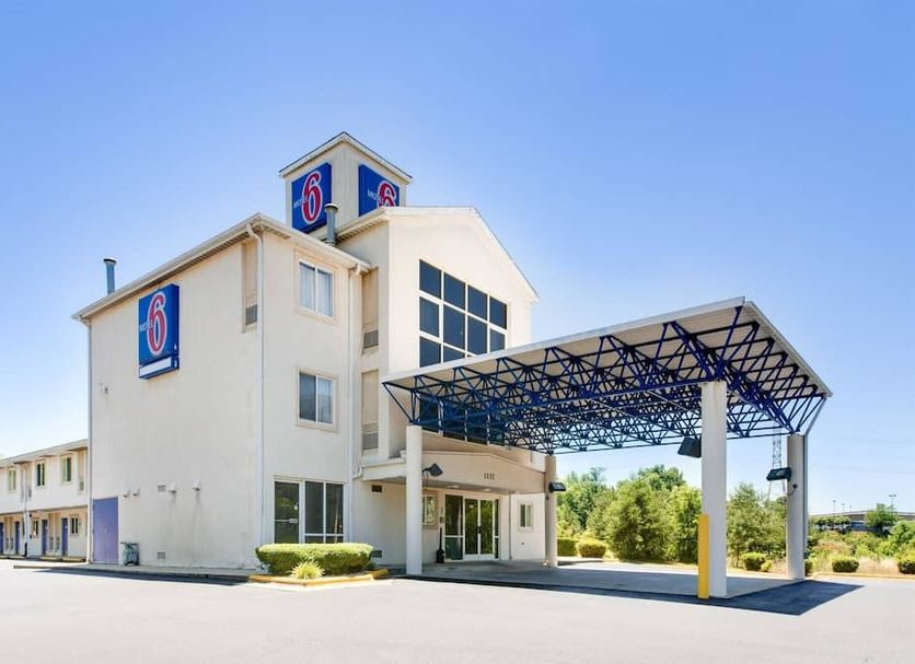 Motel 6 Statesville exterior with covered entrance and blue motel signage in Statesville