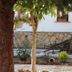 Hotel Baykal in Bogazkale courtyard with rustic wooden cart and stone wall