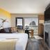 Inn at Cape Kiwanda room with ocean view of Pacific City, fireplace and bed near balcony