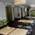 ibis budget Marseille Est Porte d'Aubagne lobby seating area with tables, stools and bright windows