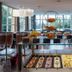Crans-Montana Youth Hostel buffet dining area with fruit displays and dessert trays in Crans-Montana