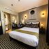 Hôtel Paulette Rouen Centre Cathédrale guest room with double bed, desk and window in Rouen