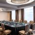Meeting room at The Lincoln Marriott Cornhusker Hotel in Lincoln with long table, chairs and large windows