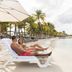 Acoya Curacao Resort, Villas & Spa beach lounge chairs on Willemstad shoreline with ocean view